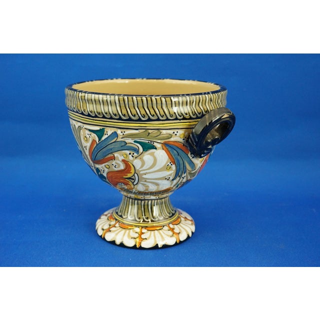 Item : A delightful two-handled vase in the shape of an ancient Roman amphora, made of vitrified enameled ceramic,...