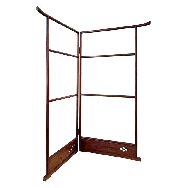 A distinguished Japanese folding kimono rack or room divider in wood with stylized floral cutouts
