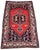 A lovely antique tribal rug, woven by the Lors tribe circa 1920. The design features a single geometrical medallion on a...