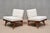 This striking pair of lounge/slipper chairs was produced in Denmark in the 1950s. The design is defined by its dynamic,...
