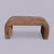 A sculptural 1980s waterfall bench fully upholstered in warm brown faux suede. The continuous rounded profile creates a...