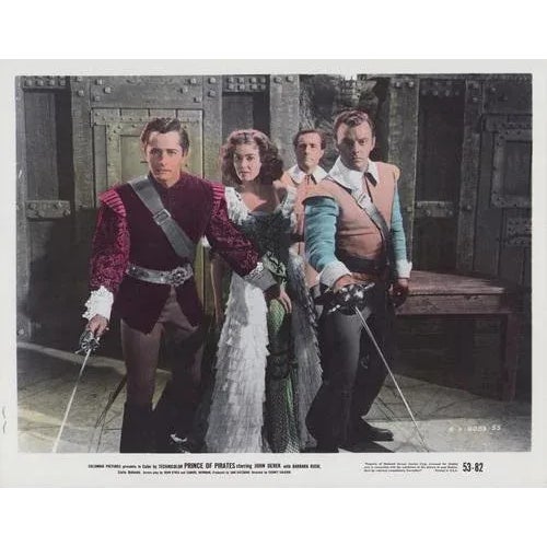 Original lobby card for the film "Prince of Pirates" (1953) featuring John Derek, Barbara Rush, and Carla Balenda. This...