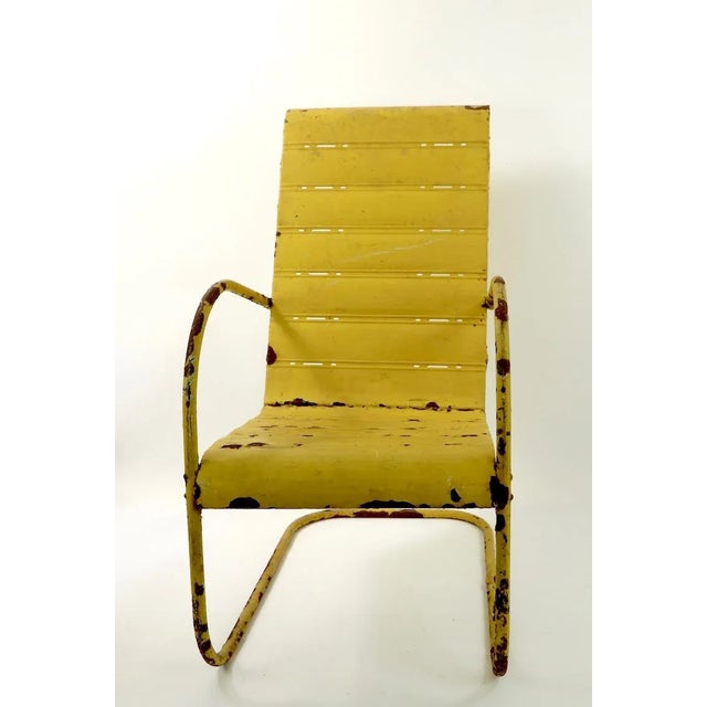 Unusual high back version outdoor garden, patio, lawn chair in peely paint, rust finish. The chair is stable and solid, it...