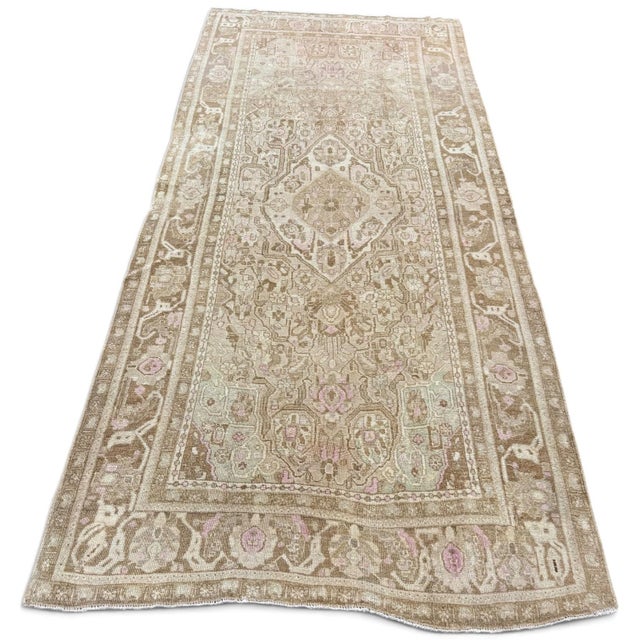 A distinctive antique Karabagh rug with an unusual composition and beautifully stylized floral motifs. A small central...