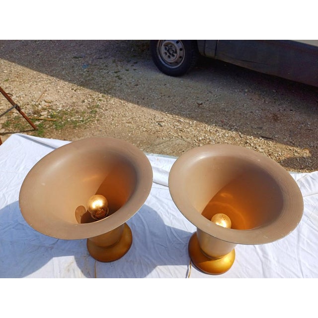 Pair of 1960s gold-plated aluminum lamps, rimmed with glass at the bottom, Height: 35.5 cm, Top Diameter: 32.5 cm and...