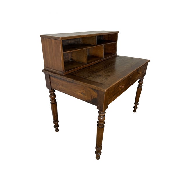 This late 19th-century French Louis Philippe style desk features a country look with turned legs and a plank tabletop. The...