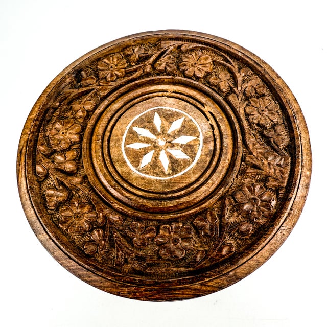 Hand-carved folding wooden plant stand or small accent table, crafted from Sheesham or teak wood. This portable, tripod-...