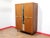 This Mid Century Modern Vintage Teak Triple Armoire Wardrobe by Stonehill in a Danish Style offers a stunning wardrobe...