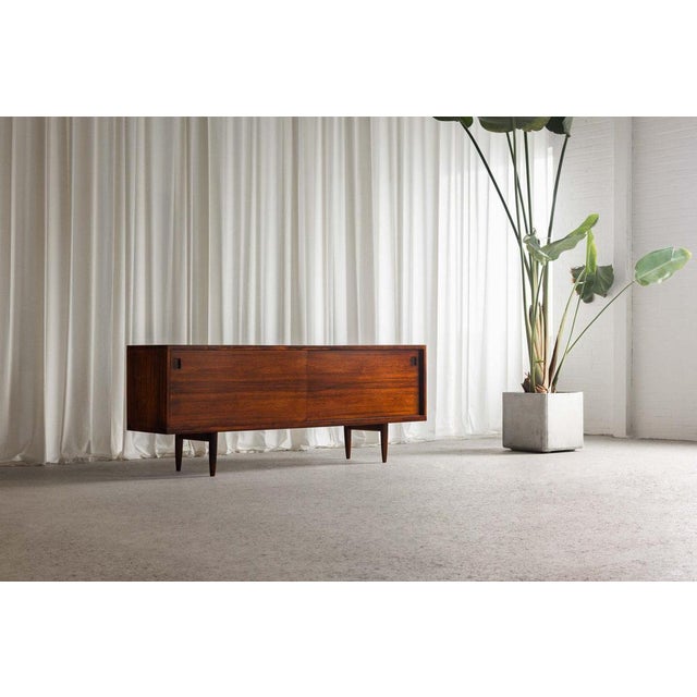This stunning model 20 sideboard, designed by niels otto møller and manufactured by j.l. Møller møbelfabrik in denmark in...