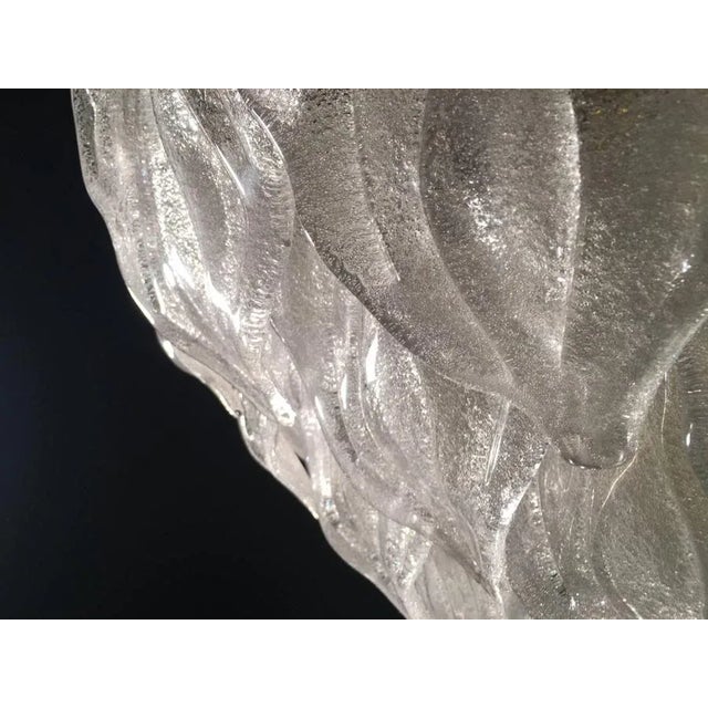 Spectacular pair of Murano chandelier. It consists of dozens of pure Murano glass leaves. Four E 27 lights. Measures:...