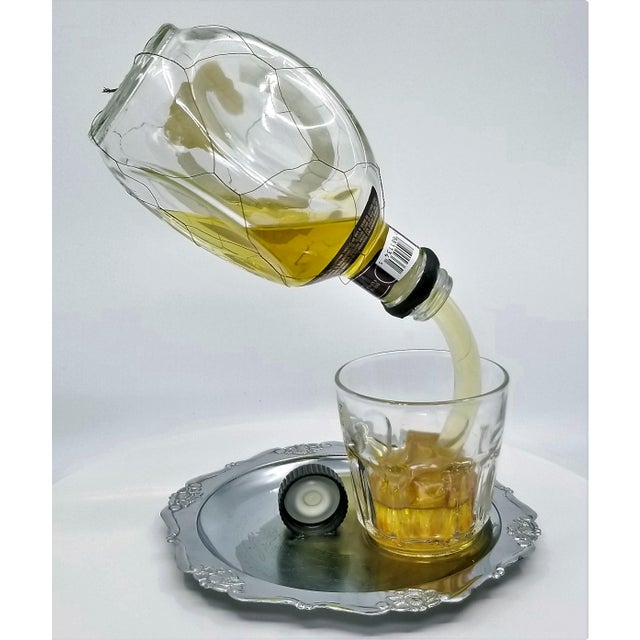 Pop Art Sculpture of Pinch Liquor Bottle Pouring a Drink Designed by