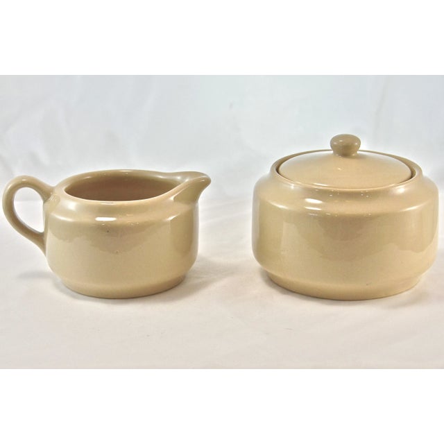 Bisque restaurant quality ceramic creamer & lidded sugar bowl. Marked “Buffalo China Cafe; Made In U.S.A.” Sugar bowl,...