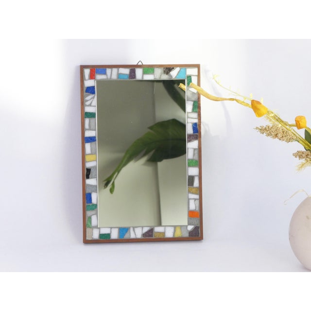 A mid century rectangular mosaic mirror made in the Netherlands and branded in the back. The frame of the mirror is made...