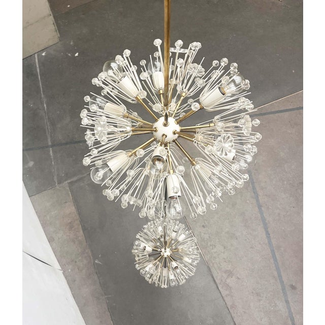 A unique double "Snowflake" rod pendant lamp by Rupert Nikoll, attributed to a design by Emil Stejnar. The lamp was...