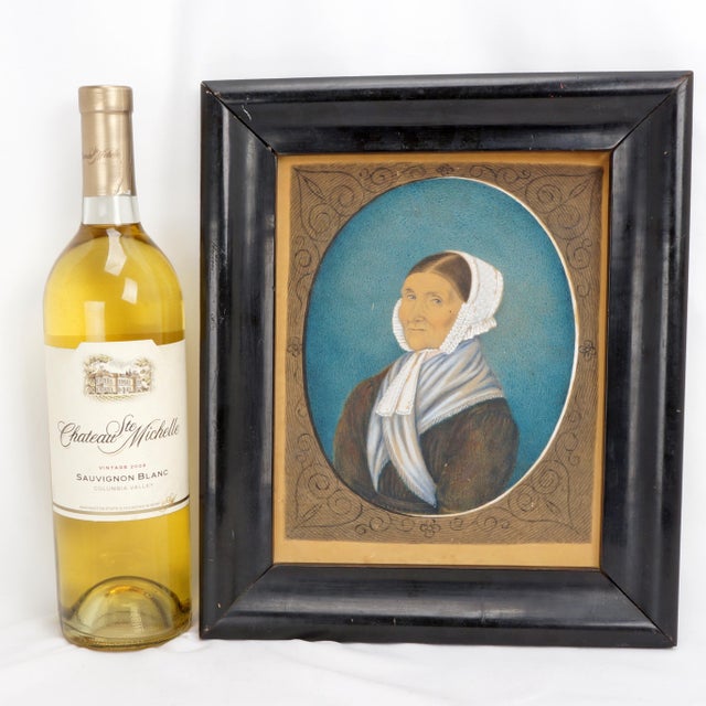 A portrait artist has captured in realism a matron with a lace bonnet and shawl from the 19th century. It is hand painted...