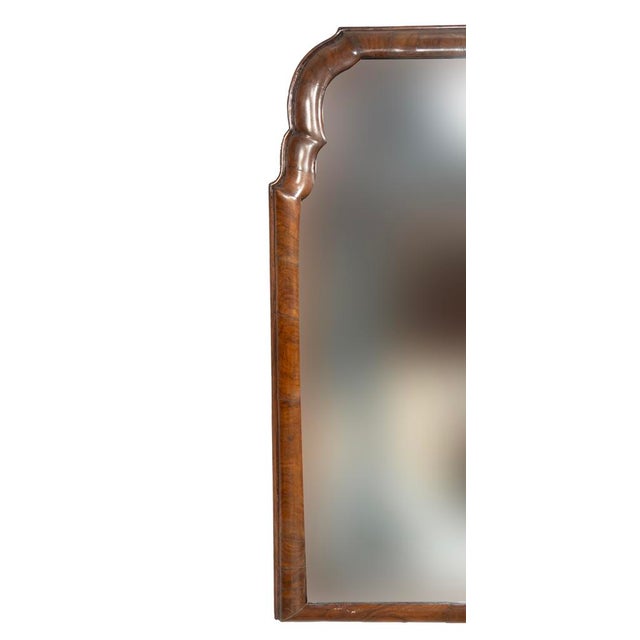 Dutch Baroque walnut mirror. With shaped arched cushion frame with beveled glass plate.