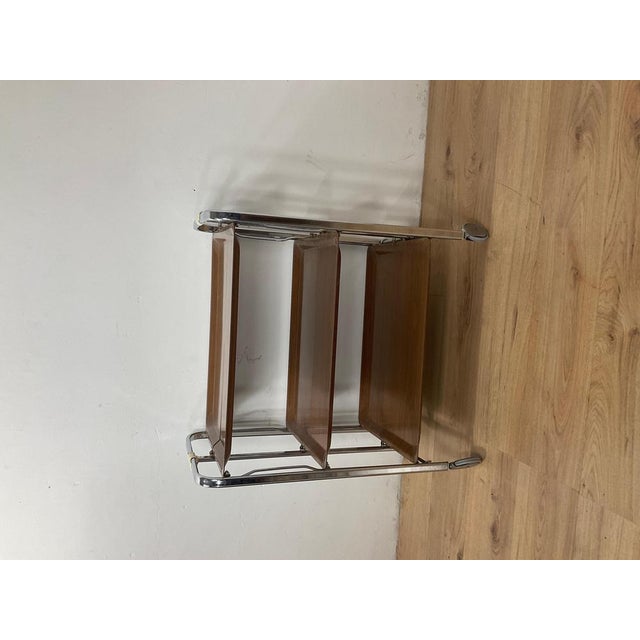 Beautiful folding service trolly on wheels from the 1960s. Chrome steel frame with 3 laminate trays. Condition: Good,...