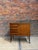 Scandinavian-style piece of furniture dating from the 1960s. It has four functional drawers and a door opening onto a...