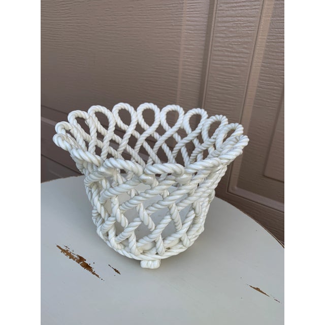 A gorgeous trompe l'oeil white French Country style reticulated porcelain woven rope basket cachepot Spain, Circa 1980s...