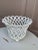 An elegant trompe l'oeil porcelain cachepot crafted in the form of a handwoven rope basket. Executed in glossy white...
