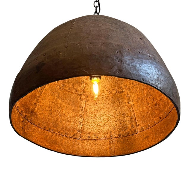 Vintage iron pendant light crafted from a hand-forged bowl from early–mid 20th century India. Such vessels were...