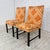 Pair of Paul Evans dining chairs in a bold orange and white geometric Paul Evans textile. The wooden frame is stained a...