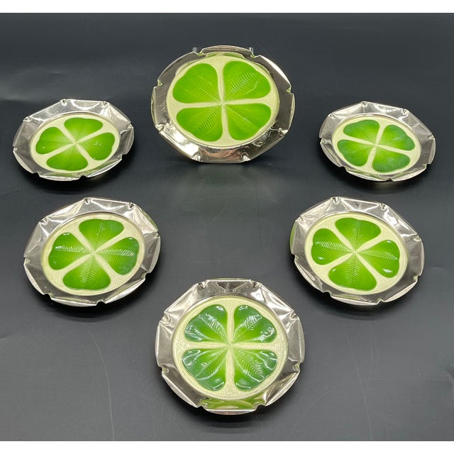 A charming set of six champagne coasters, consisting of one larger bottle coaster and five smaller ones for glasses....