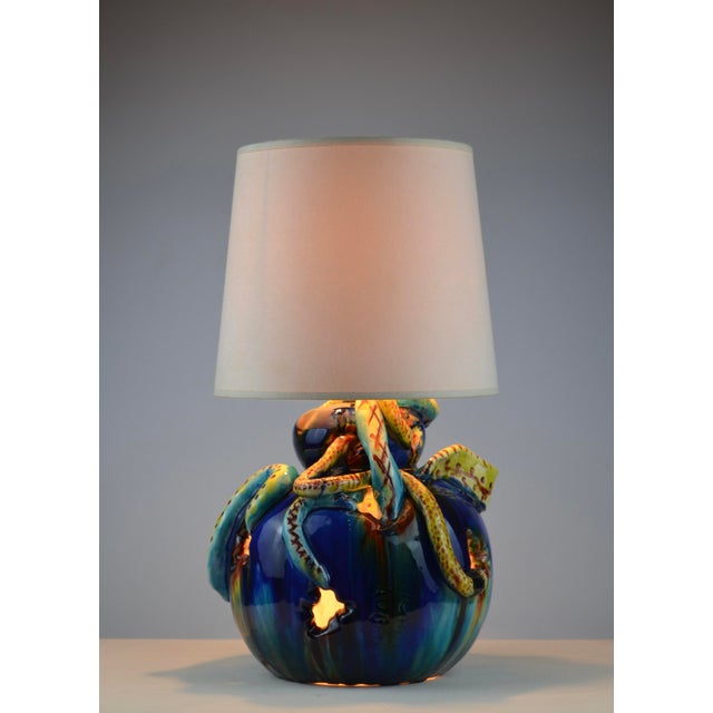 This exceptional French ceramic table lamp, attributed to Vallauris and dating from circa the 1950s, is a remarkable...