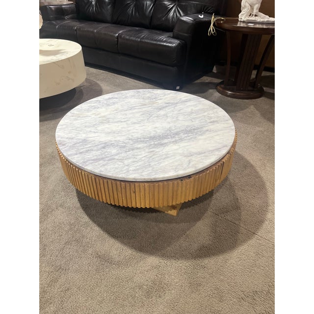 This refined Four Hands “Leland” Round Coffee Table offers a sophisticated blend of natural warmth and elevated materials....