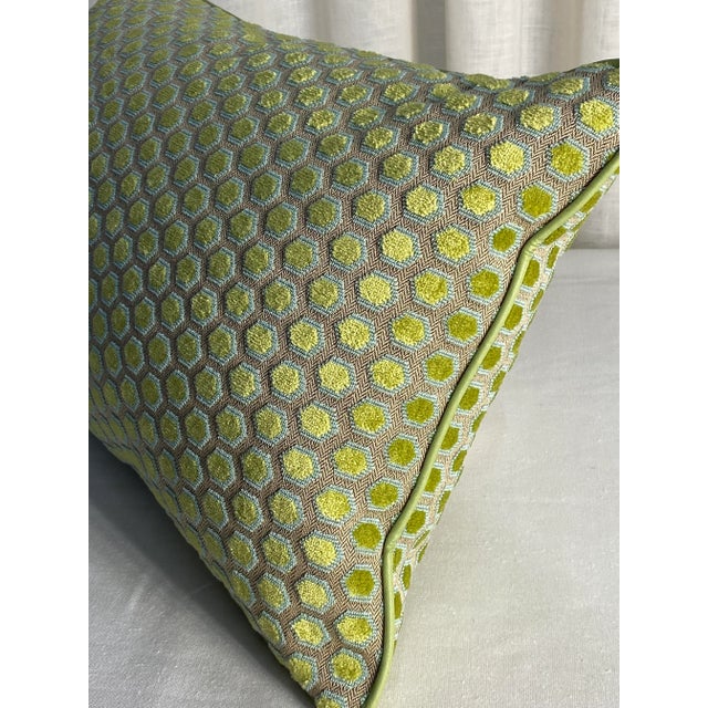 Modern figured geometric upholstery cut, looped and voided cotton & viscose velvet, trimmed with a solid spring green...