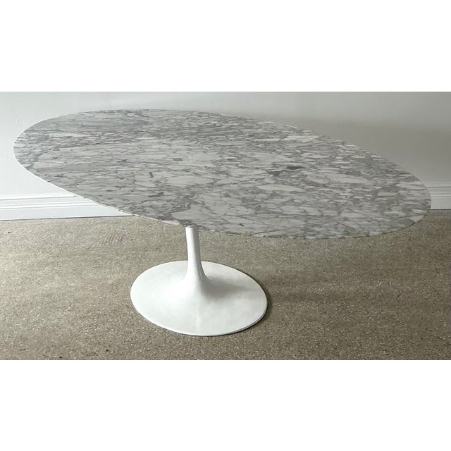 This vintage marble tulip dining table, designed after Eero Saarinen, makes a sweeping modernist statement in any dining...