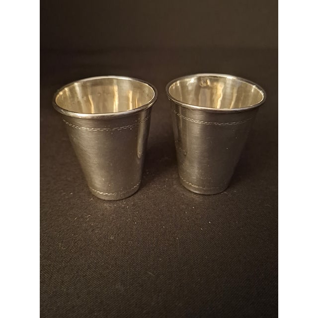 Offered is a fine matching pair of vintage Polish solid .800 silver miniature Kiddush cups / shot cups, crafted circa...