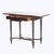 A refined 19th-century lady's drop-leaf desk, attributed to the esteemed French ébéniste François Linke, exemplifies the...