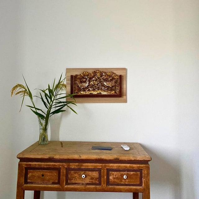 This rare early 20th-century Chinese architectural panel features a pair of long-tailed pheasants among lush floral...