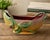 A scarce Weller Pottery Malvern oval jardinière dating to the late 1920s or early 1930s. This sculptural planter features...