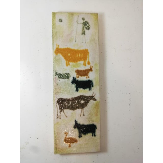 Ceramic plate decorated with primitive motifs by Aldo Londi for Bitossi. They represent both animal and human figures....