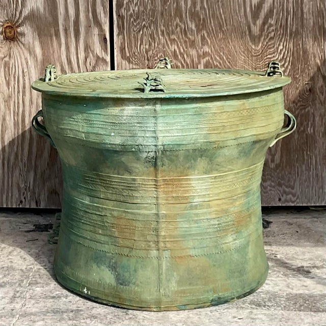 A fantastic vintage Boho side table. A chic bronze drum table with lots of beautiful detail. A fantastic all over patina...