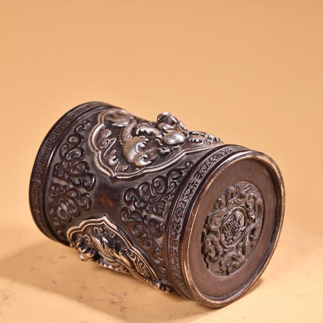 This impressive vintage Chinese brush pot (bitong) is crafted from solid bronze, featuring a rich, dark patina with...