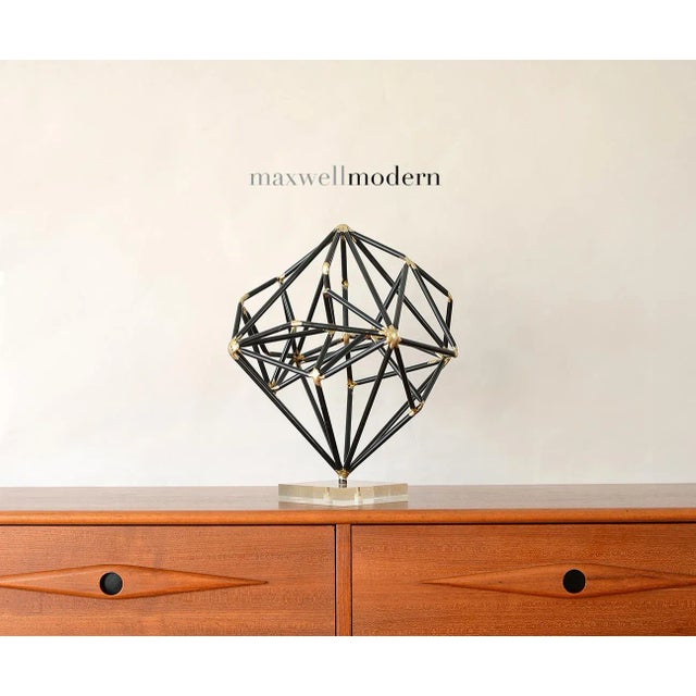 Striking vintage modernist black metal sculpture with brass welded joints. This sculpture can be displayed at many...