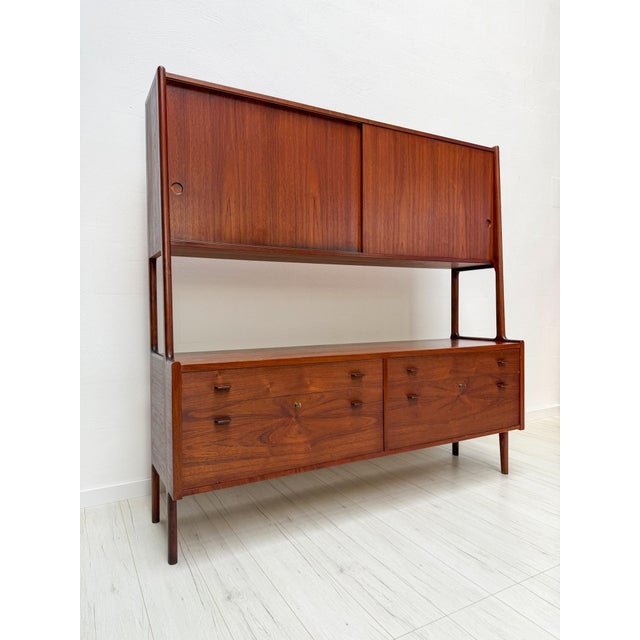 The ry20 highboard, designed by hans j. Wegner in the early 1950s for ry møbler, is a refined example of danish modern...