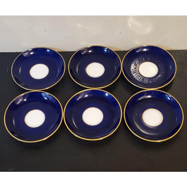 Set of six English Mintons petite blue porcelain saucers with hand-applied 24K gold accents. Circa 1800s. Maker's mark on...