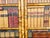 An English bamboo cabinet from the early 20th century, with faux books façade. Created in England during the early years...