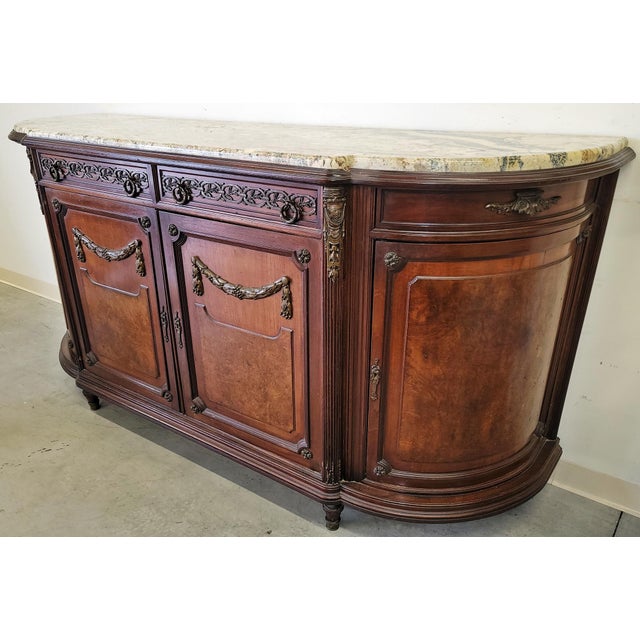 More evidence that the French made the best furniture extant, this 1880s Louis XVI style marble top mahogany buffet or...