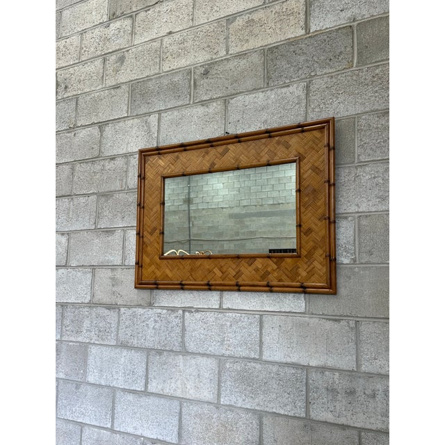 Very large bamboo mirror with nice faux bamboo frame, and herringbone pattern to inside. Could be hung either way. Overall...