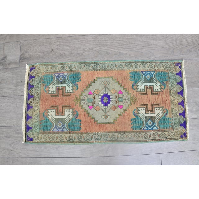 This is a vintage Turkish Oushak rug from the 1960s. The piece was hand-knotted.