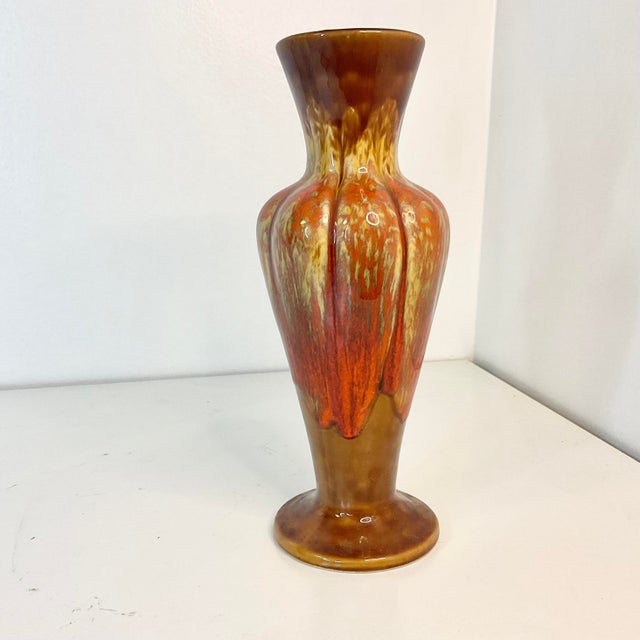 Offering this Americana Folk Art Ceramic Vase. The artist chose a palette of browns, tans, reds, burnt orange and a faded...