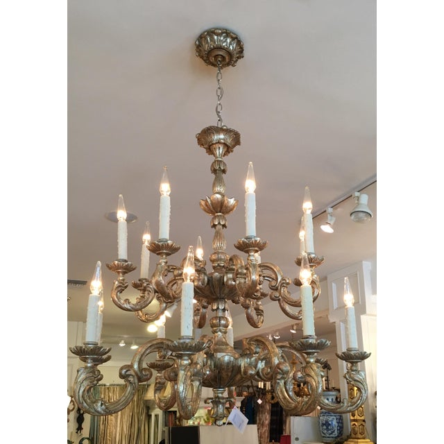 This lovely chandelier is a genuine designer fixture and features 16 lights and a classic Italian form in white gold on...