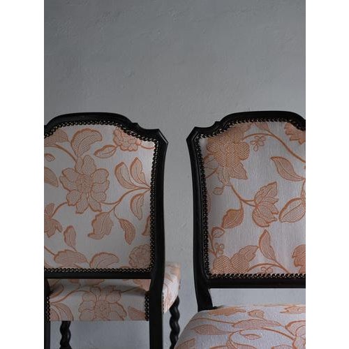 Set of two oak chairs with barley twist legs and string seats. New Italian cotton upholstery. Condition: Good vintage...