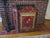 This is a Vintage French Country Red & Multi Colored Ornate Rooster Design Fire Screen with a design of beautiful flowers...