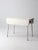 An antique wood drop-leaf table with a beautifully aged white-painted surface, showing rich natural crackling and patina...